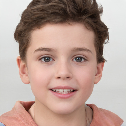 Joyful white child male with short  brown hair and grey eyes