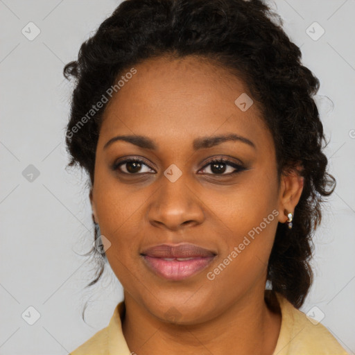 Joyful black young-adult female with long  black hair and brown eyes