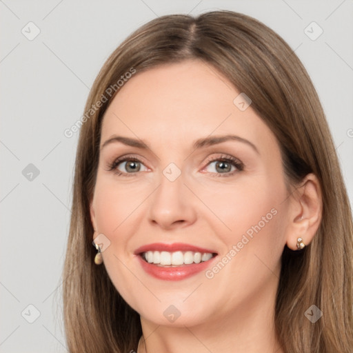 Joyful white adult female with long  brown hair and brown eyes