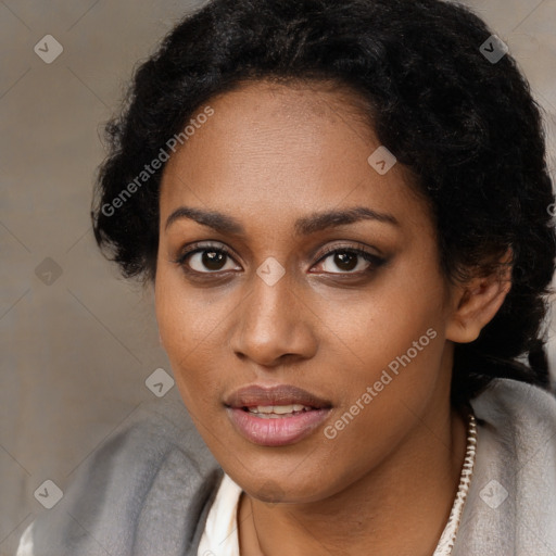 Joyful black young-adult female with short  black hair and brown eyes