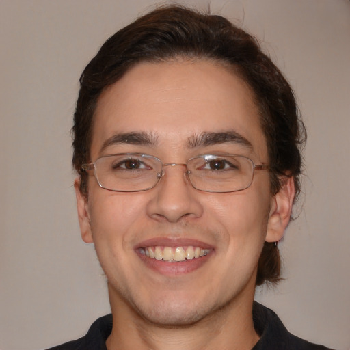 Joyful white adult male with medium  brown hair and brown eyes