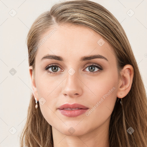 Joyful white young-adult female with long  brown hair and blue eyes