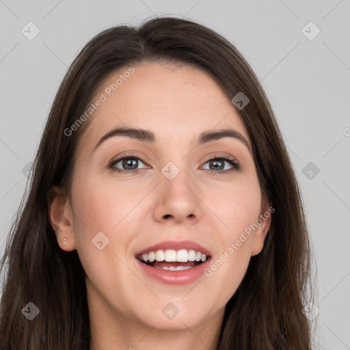 Joyful white young-adult female with long  brown hair and grey eyes