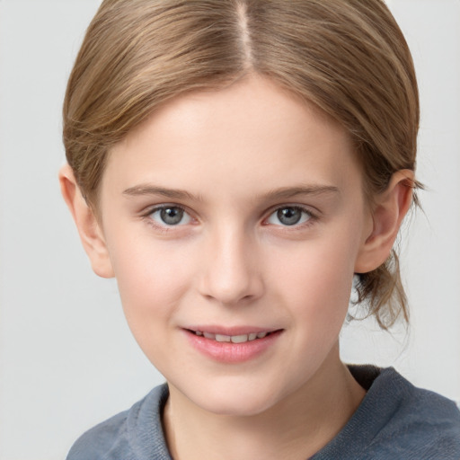 Joyful white child female with medium  brown hair and grey eyes