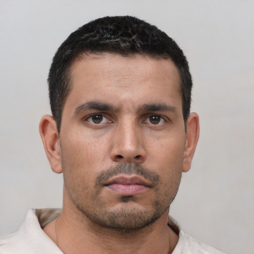 Neutral white young-adult male with short  black hair and brown eyes
