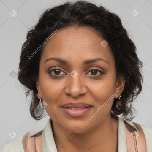 Joyful black adult female with medium  brown hair and brown eyes