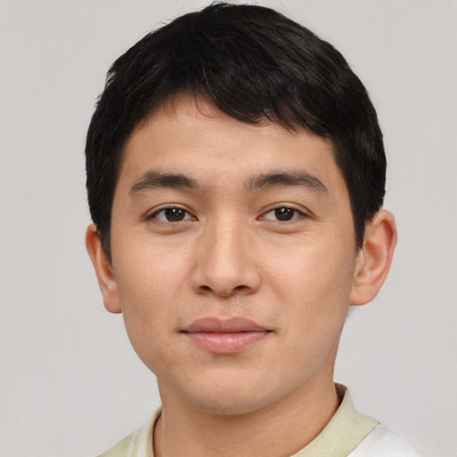 Joyful asian young-adult male with short  black hair and brown eyes