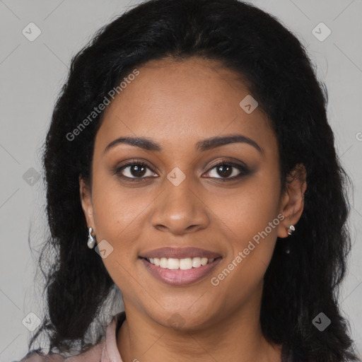 Joyful black young-adult female with long  brown hair and brown eyes