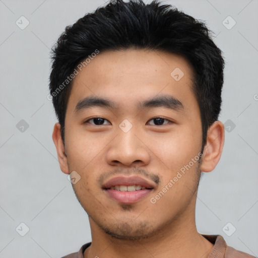 Joyful asian young-adult male with short  black hair and brown eyes