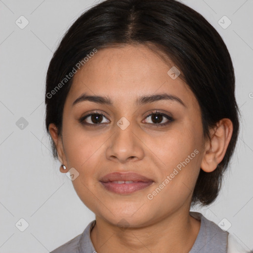 Joyful latino young-adult female with medium  brown hair and brown eyes