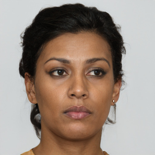 Neutral latino young-adult female with short  brown hair and brown eyes