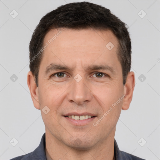 Joyful white adult male with short  brown hair and brown eyes