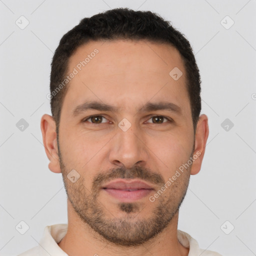 Joyful white adult male with short  brown hair and brown eyes