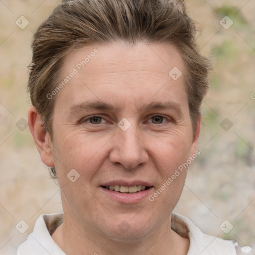 Joyful white adult female with short  brown hair and grey eyes