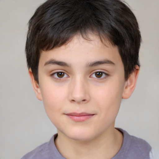 Joyful white child male with short  brown hair and brown eyes