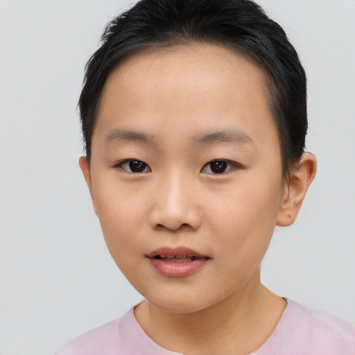 Joyful asian child female with short  brown hair and brown eyes