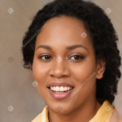 Joyful black young-adult female with long  brown hair and brown eyes