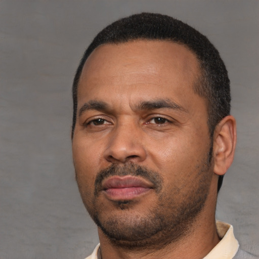 Neutral latino adult male with short  black hair and brown eyes
