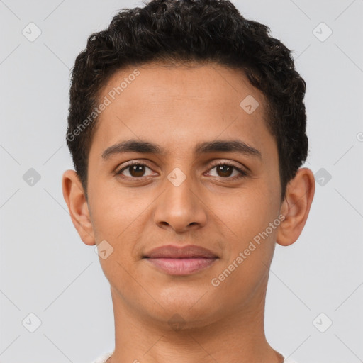 Joyful latino young-adult male with short  brown hair and brown eyes