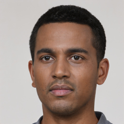 Neutral black young-adult male with short  black hair and brown eyes