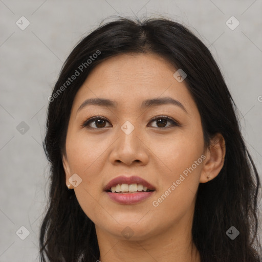 Joyful latino young-adult female with long  brown hair and brown eyes