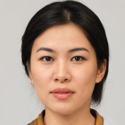 Neutral asian young-adult female with medium  brown hair and brown eyes