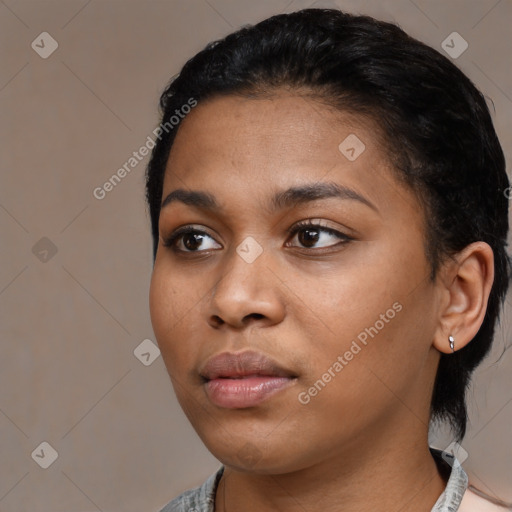 Neutral black young-adult female with medium  black hair and brown eyes