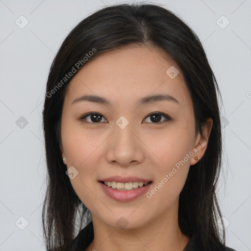 Joyful asian young-adult female with long  brown hair and brown eyes