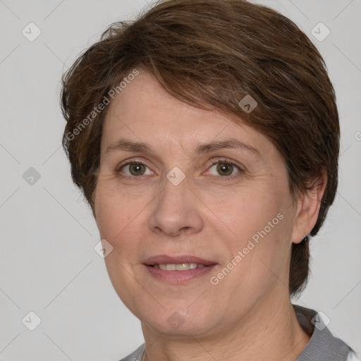 Joyful white adult female with medium  brown hair and grey eyes