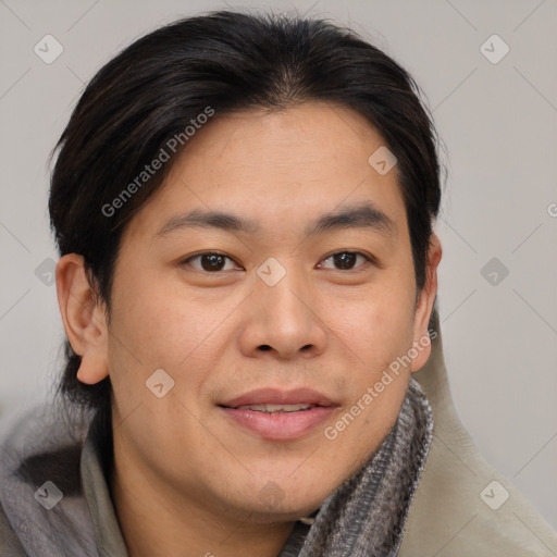 Joyful asian young-adult male with short  brown hair and brown eyes