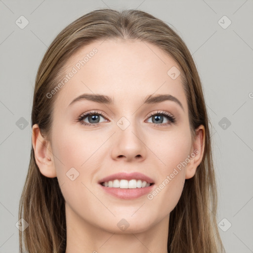 Joyful white young-adult female with long  brown hair and grey eyes