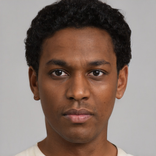 Neutral black young-adult male with short  black hair and brown eyes