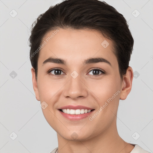 Joyful white young-adult female with short  brown hair and brown eyes