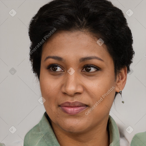 Joyful black adult female with short  brown hair and brown eyes