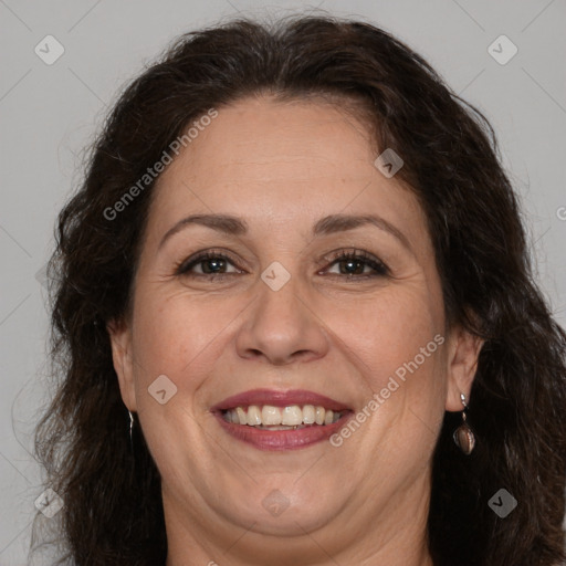 Joyful white adult female with long  brown hair and brown eyes