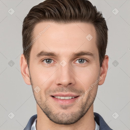 Joyful white young-adult male with short  brown hair and grey eyes