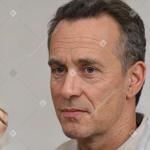 Neutral white middle-aged male with short  brown hair and brown eyes