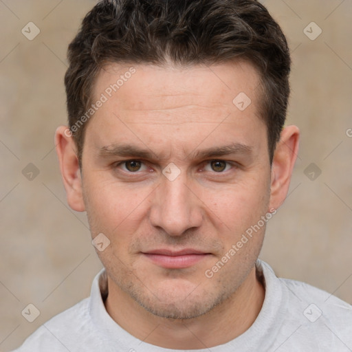 Joyful white adult male with short  brown hair and brown eyes