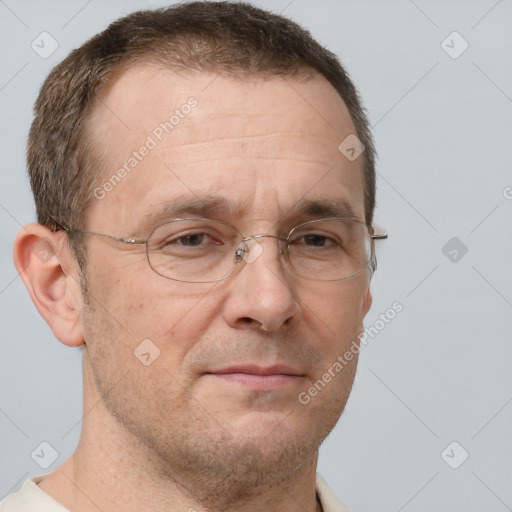 Joyful white adult male with short  brown hair and grey eyes