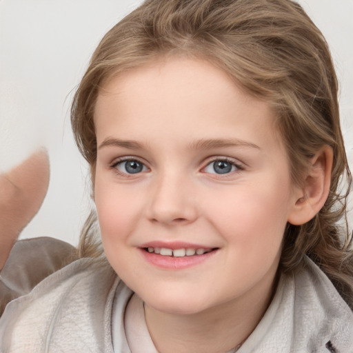 Joyful white child female with medium  brown hair and brown eyes