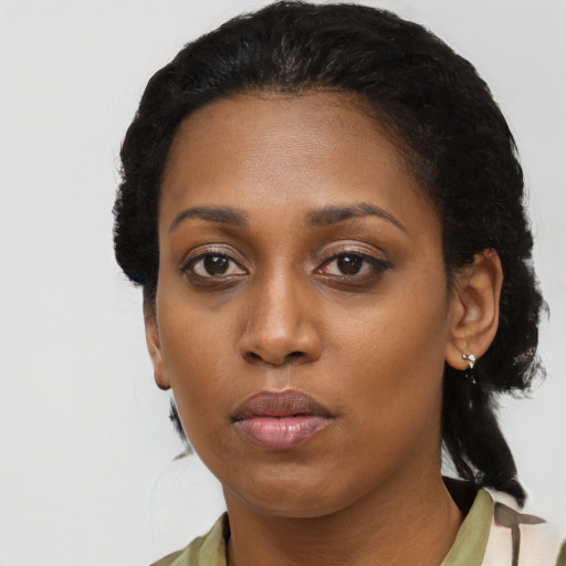 Neutral black young-adult female with long  black hair and brown eyes