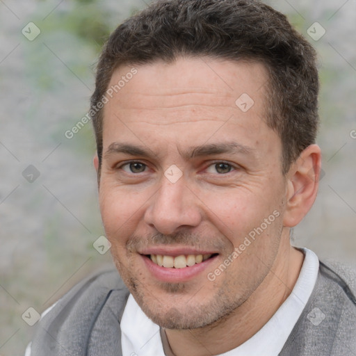 Joyful white adult male with short  brown hair and brown eyes