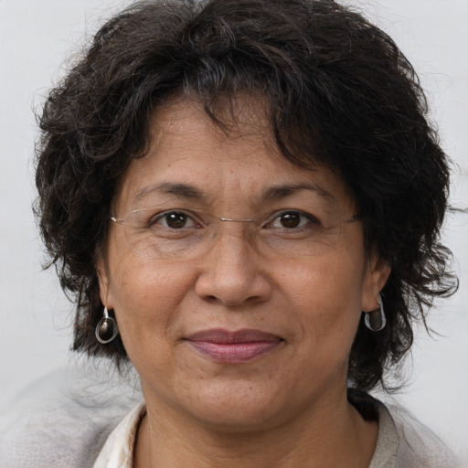 Joyful asian adult female with medium  brown hair and brown eyes