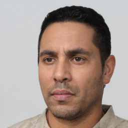 Neutral white young-adult male with short  black hair and brown eyes