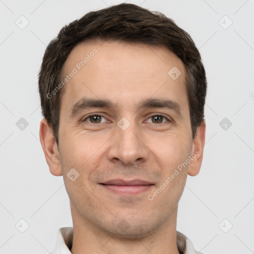 Joyful white adult male with short  brown hair and brown eyes