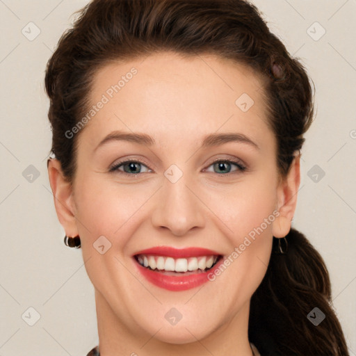 Joyful white young-adult female with long  brown hair and grey eyes