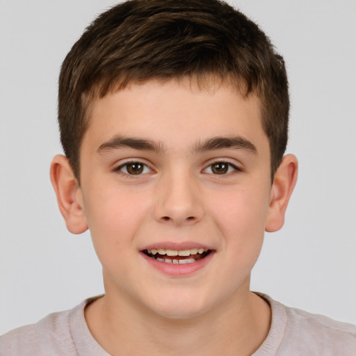 Joyful white child male with short  brown hair and brown eyes