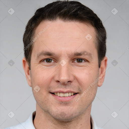 Joyful white adult male with short  brown hair and brown eyes