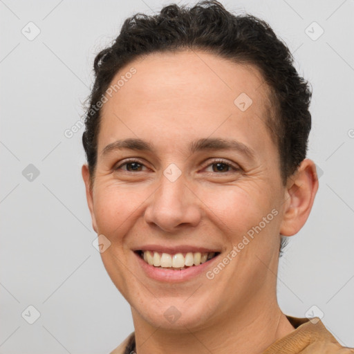 Joyful white adult female with short  brown hair and brown eyes