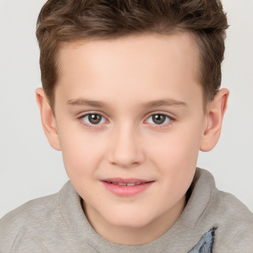 Joyful white child female with short  brown hair and brown eyes